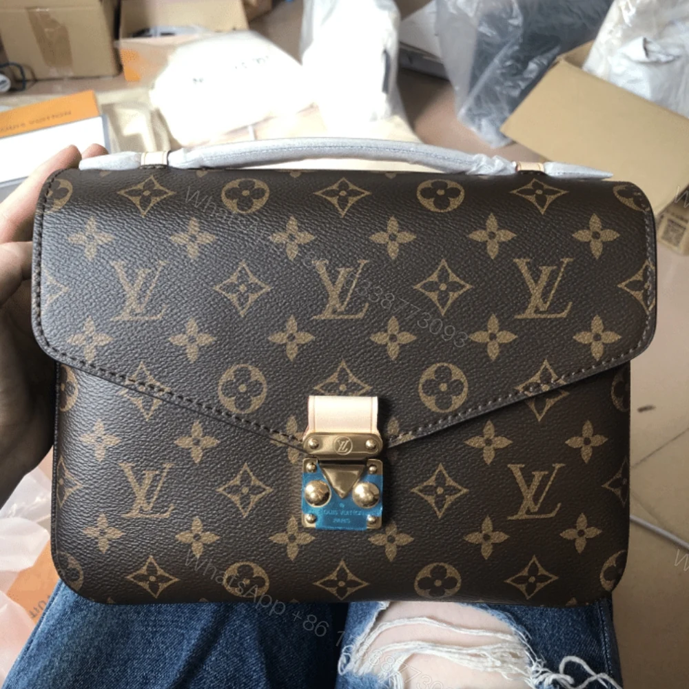 View 2 of Louis Vuitton Pochette Métis Monogram Canvas Brown 25Cm M44875