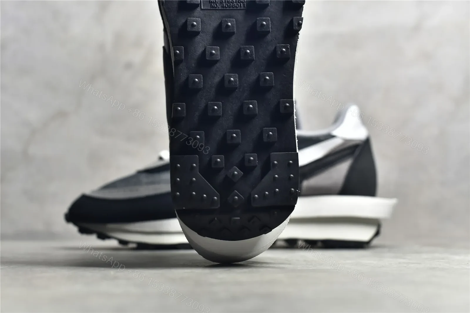 View 9 of Sacai × Nike Waffle Black and White Reps