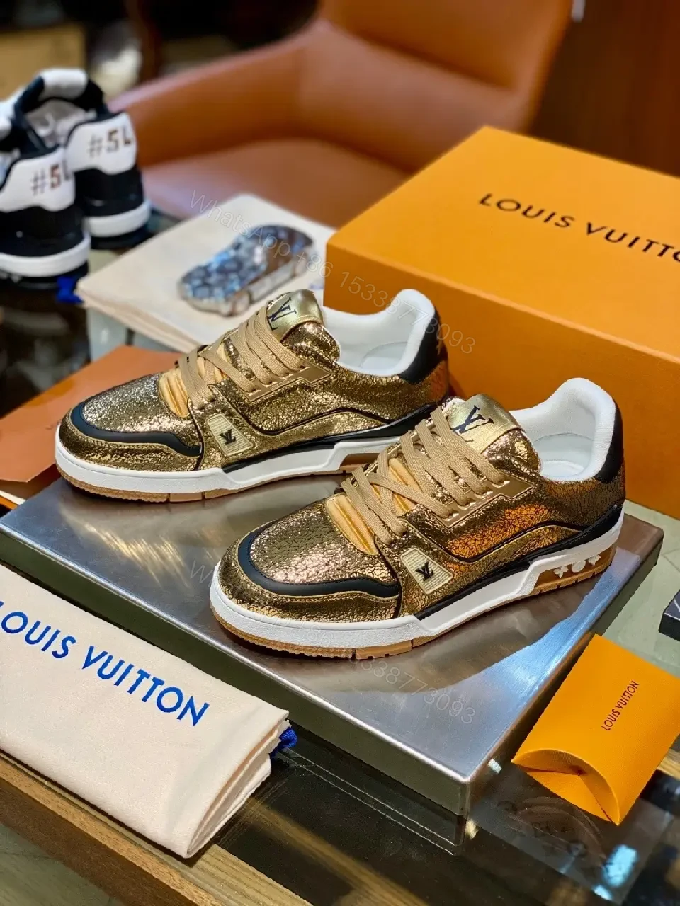 View 8 of Metallic Leather High-Top Sneakers with Subtle LV Detailing