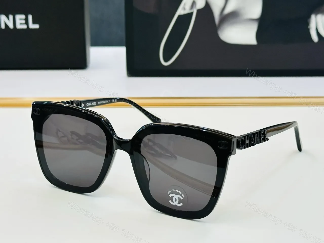View 7 of Bold Black Frame Sunglasses with Gold Detailing