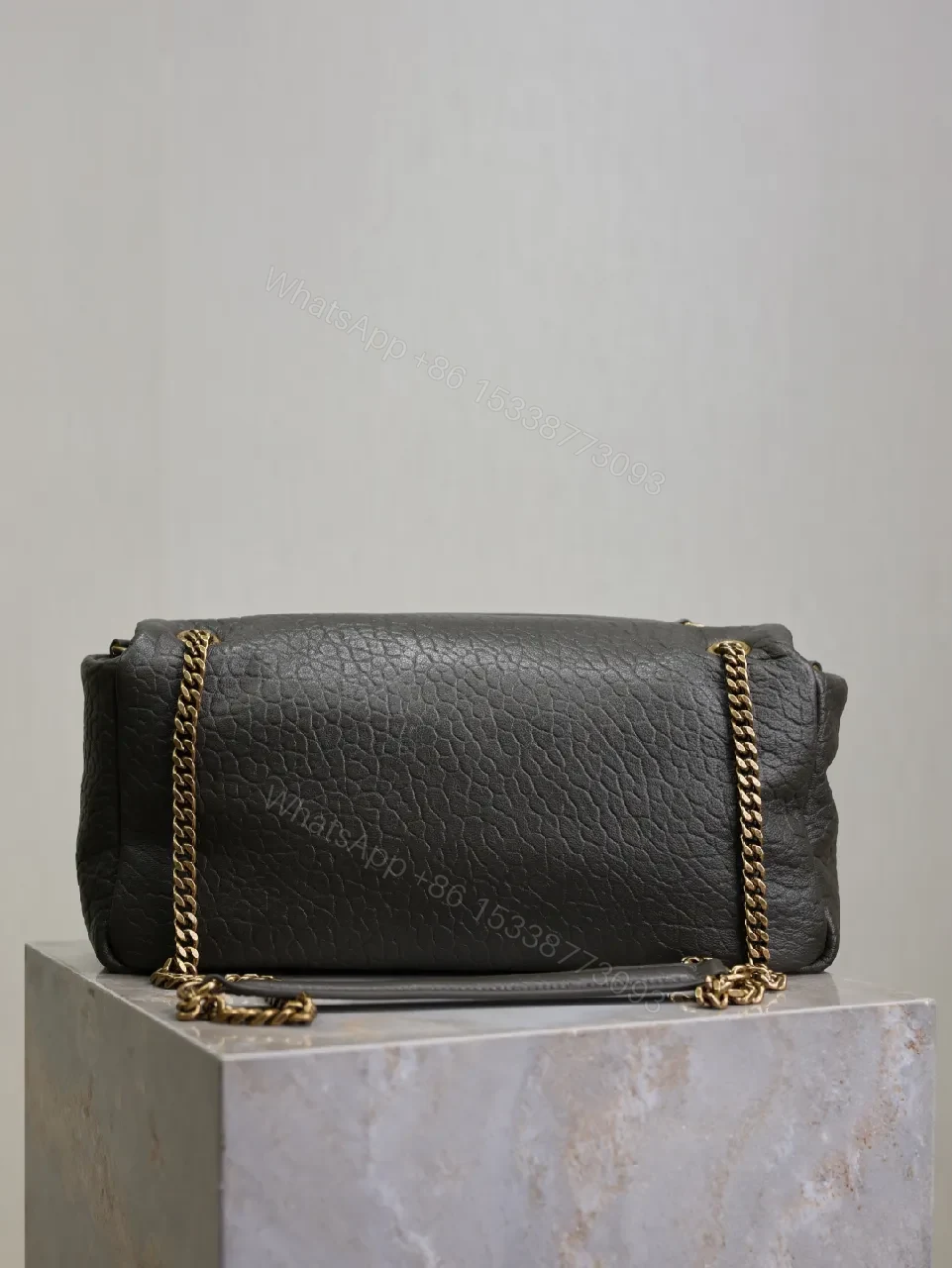 View 3 of Textured Leather Envelope Bag: Black + Gold Accent, Compact Luxury Shoulder Bag