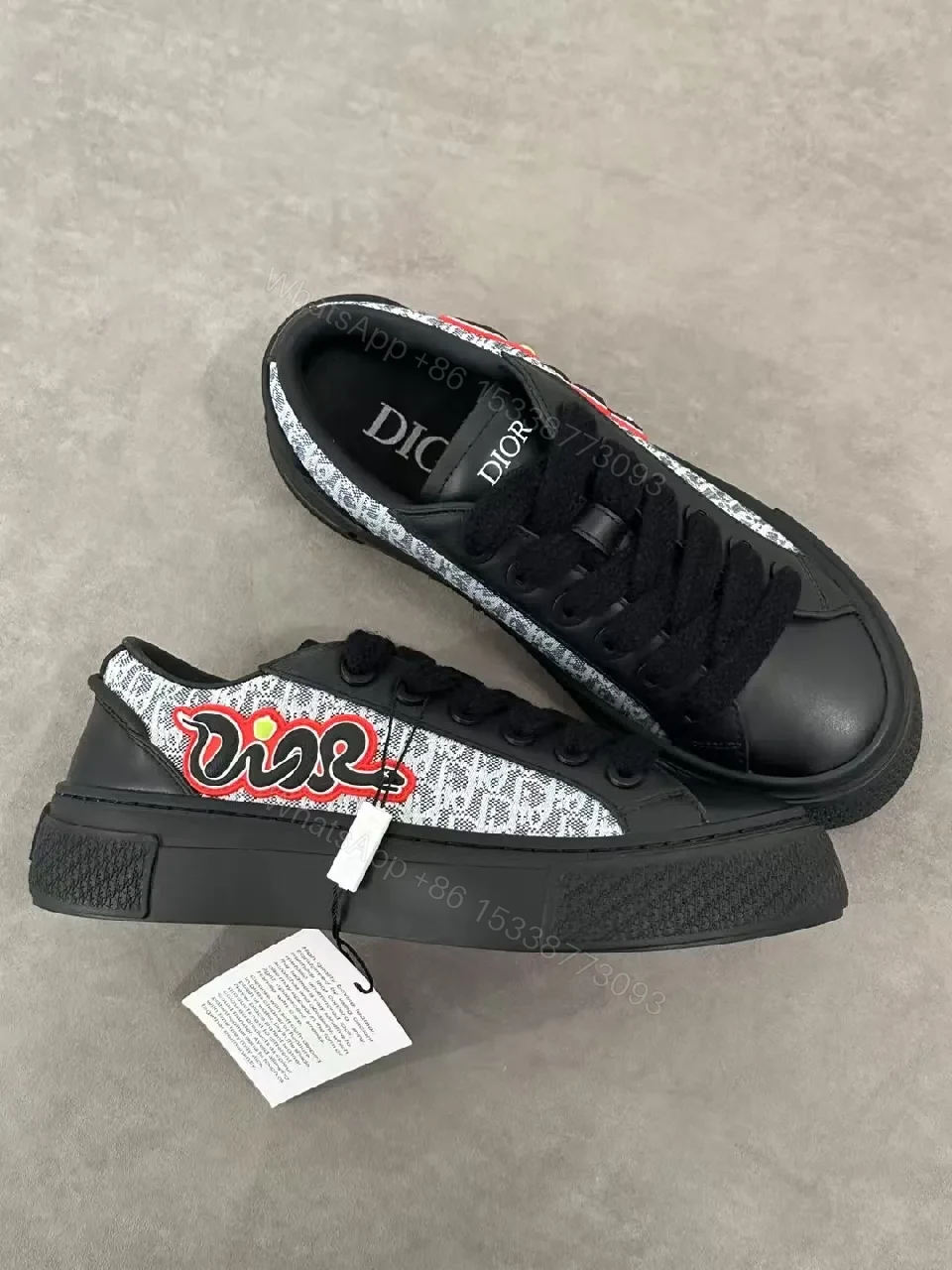 View 2 of Bold Leather High-Top Sneakers with Red Script Graphic