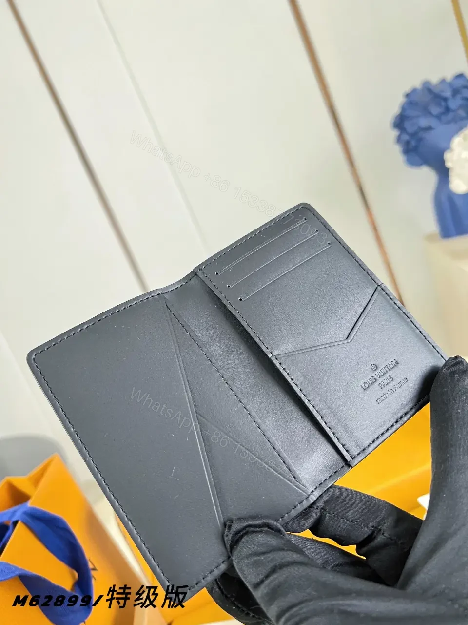 View 6 of Black Leather Slim Bi-Fold Wallet with Embossed LV Pattern
