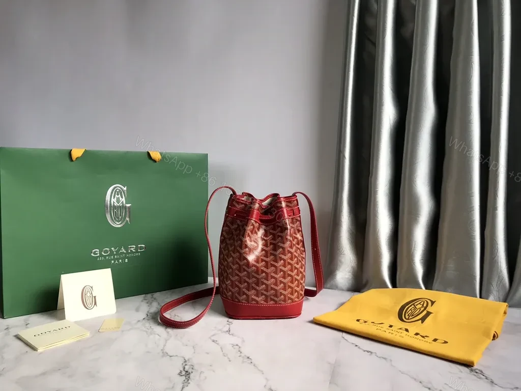 View 5 of Bold Goyardine Bucket Bag in Red Leather Trim