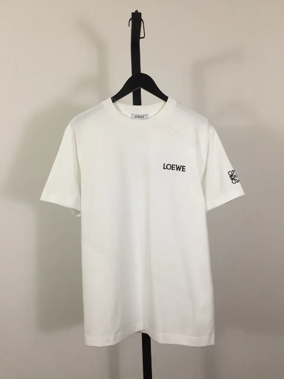 View 4 of Minimalist White Tee with Signature Accents—Premium Cotton-jersey Tee