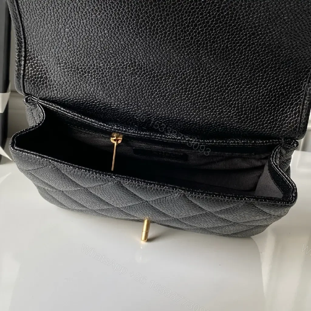 View 2 of Quilted Black Bag with Gold Chain—Timeless Luxury Utility