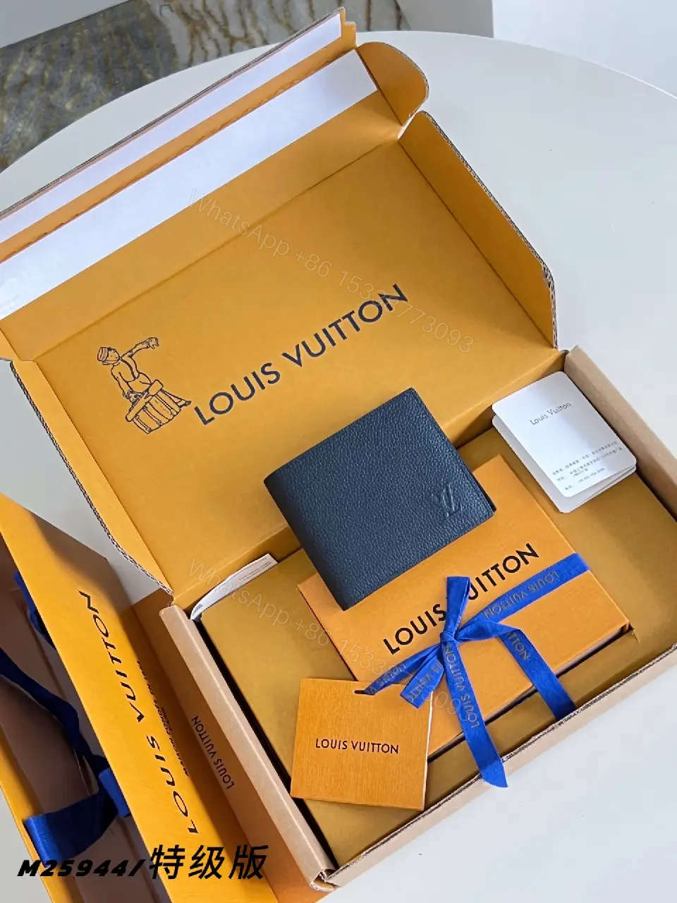View 6 of Bright Louis Vuitton Orange Boxed Wallet Set with Navy Pebbled Wallet