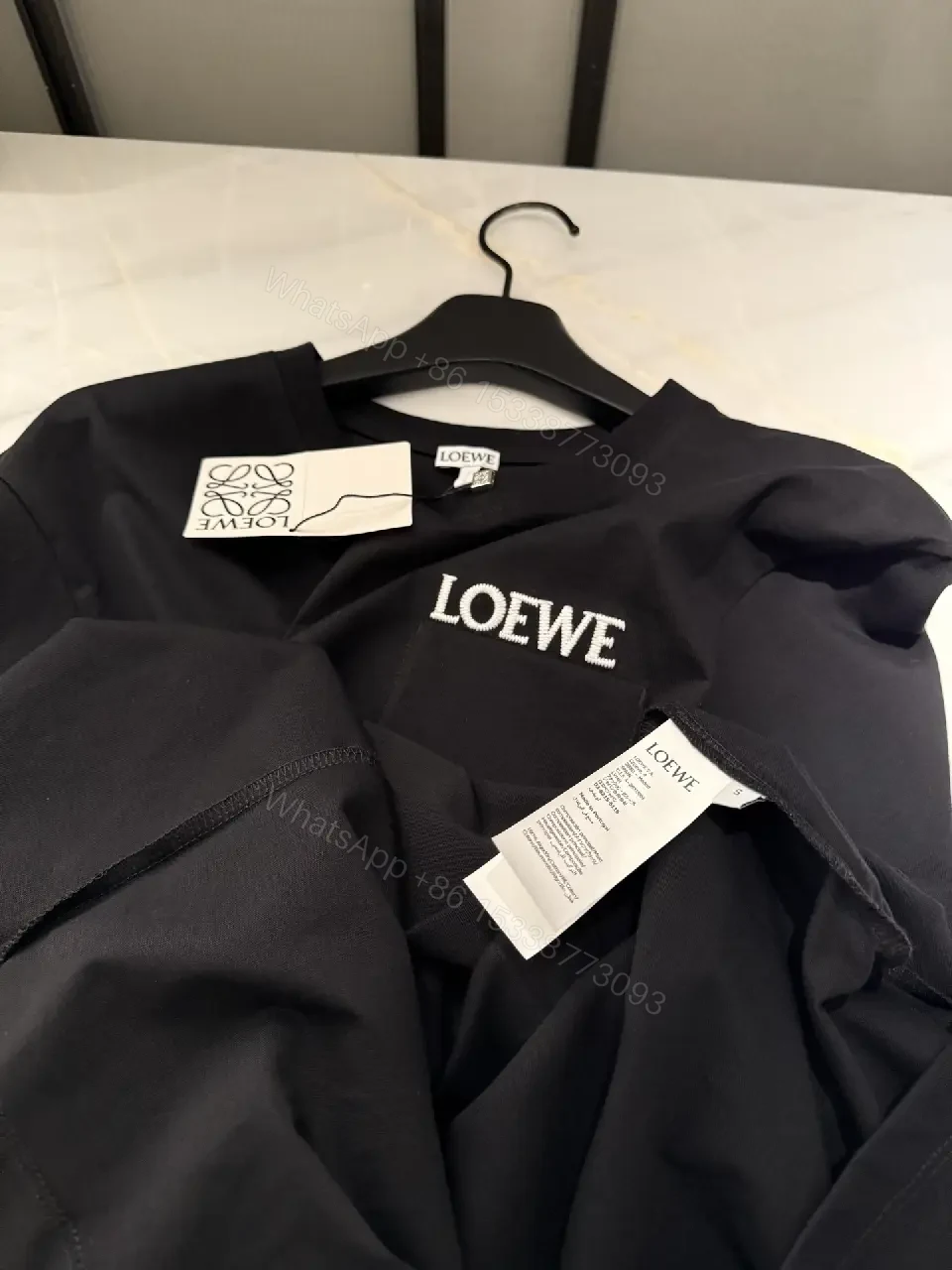 View 2 of Black Cotton Crew Tee with Pocket – Subtle Luxe Comfort