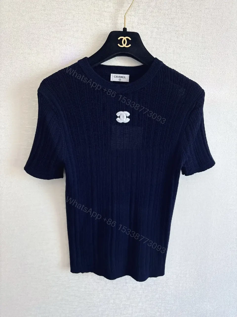 View 4 of Navy Knit Tee: Ribbed Texture, Subtle Crest Emblem, Luxe Casual