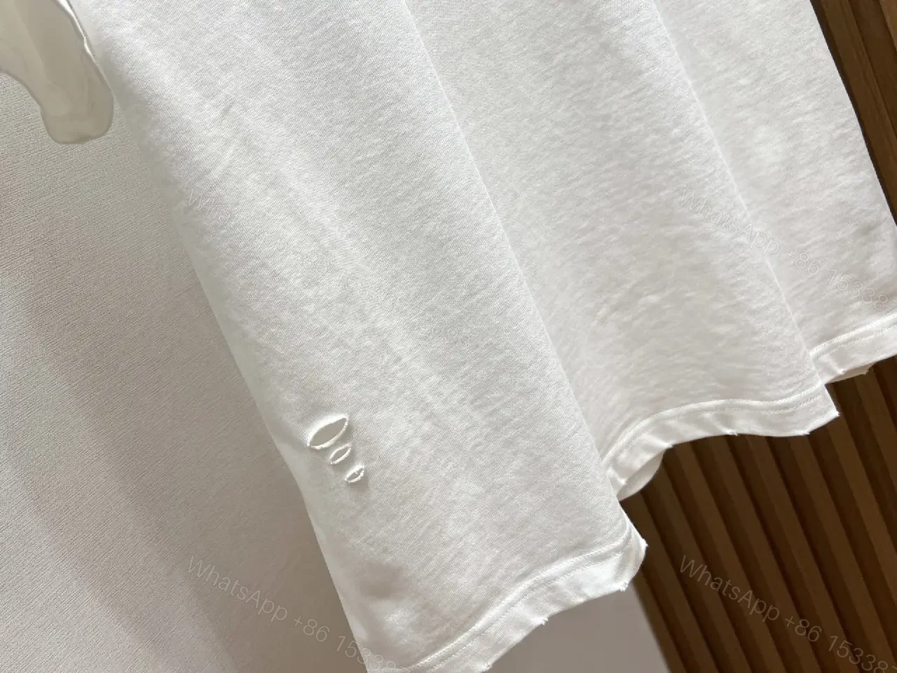 View 7 of White Cotton Minimalist Logo Tee with Subtle Hardware Details