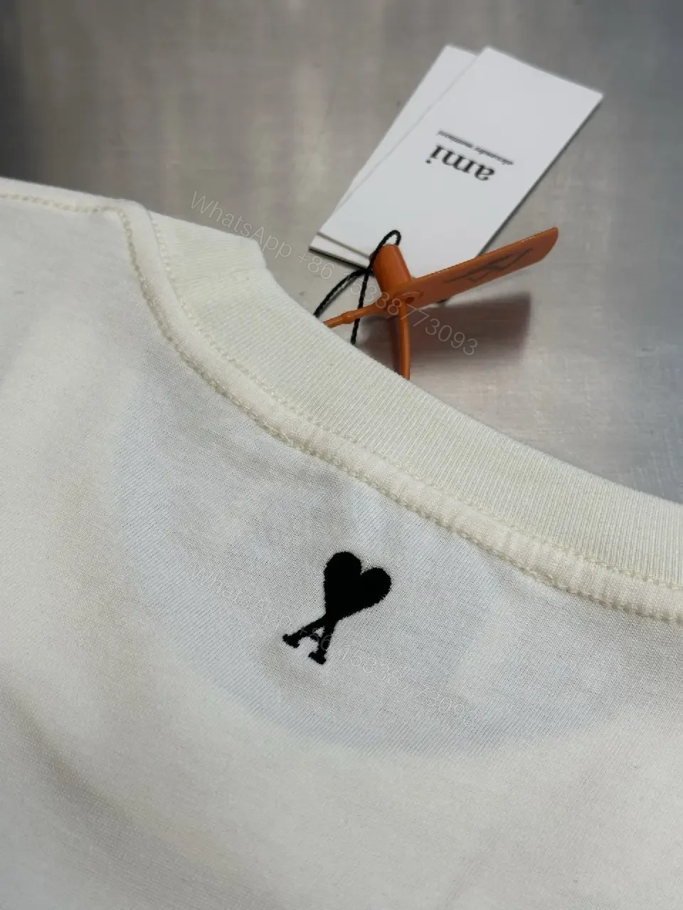View 4 of Paris Flair Tee: Off-White Cotton Blend, Minimal Crest Graphic