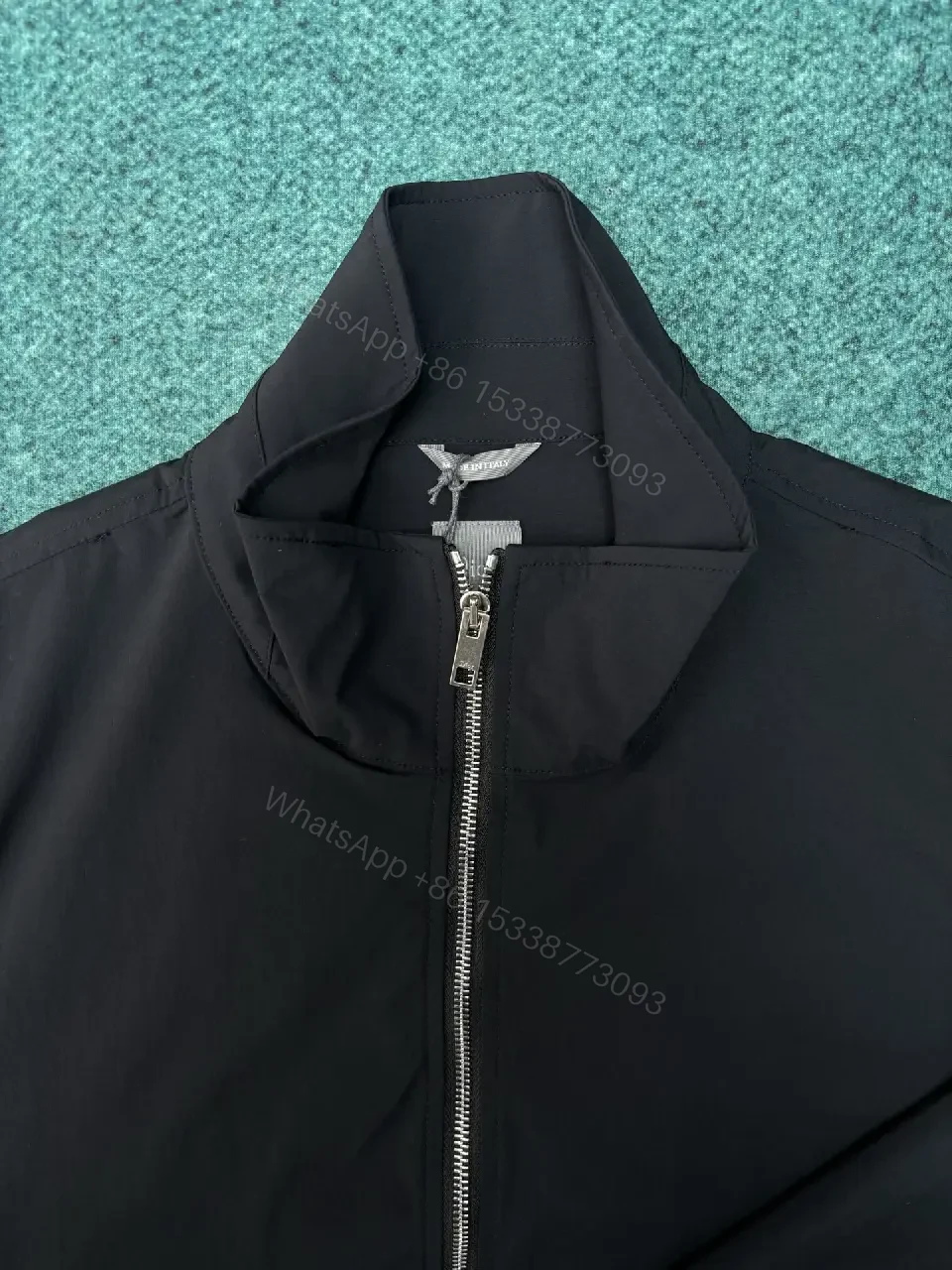 View 7 of Black Shell Bomber Jacket - Minimalist Luxury, Subtle Branding, Lightweight Warmth