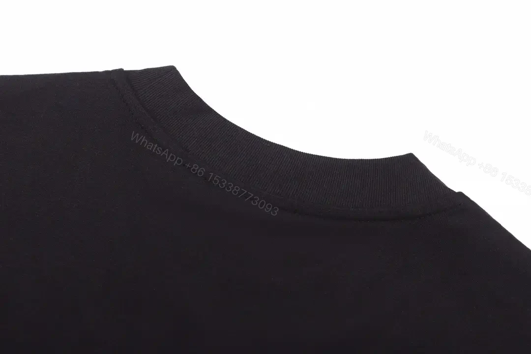 View 7 of Matte Black Cotton Tee with Subtle Embossed Logo, Modern Comfort