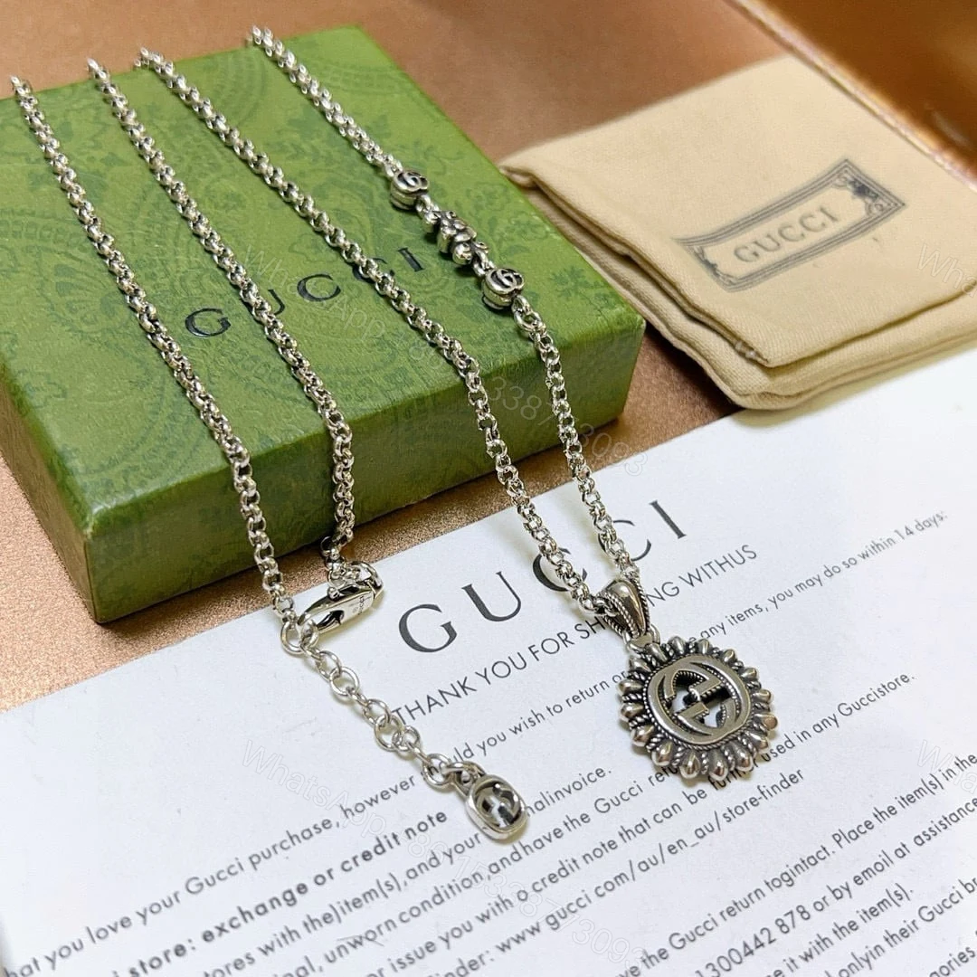 View 4 of GUCCI INTERLOCKING G LOGO EMBELLISHED PENDANT STATION NECKLACE GOLD TONE