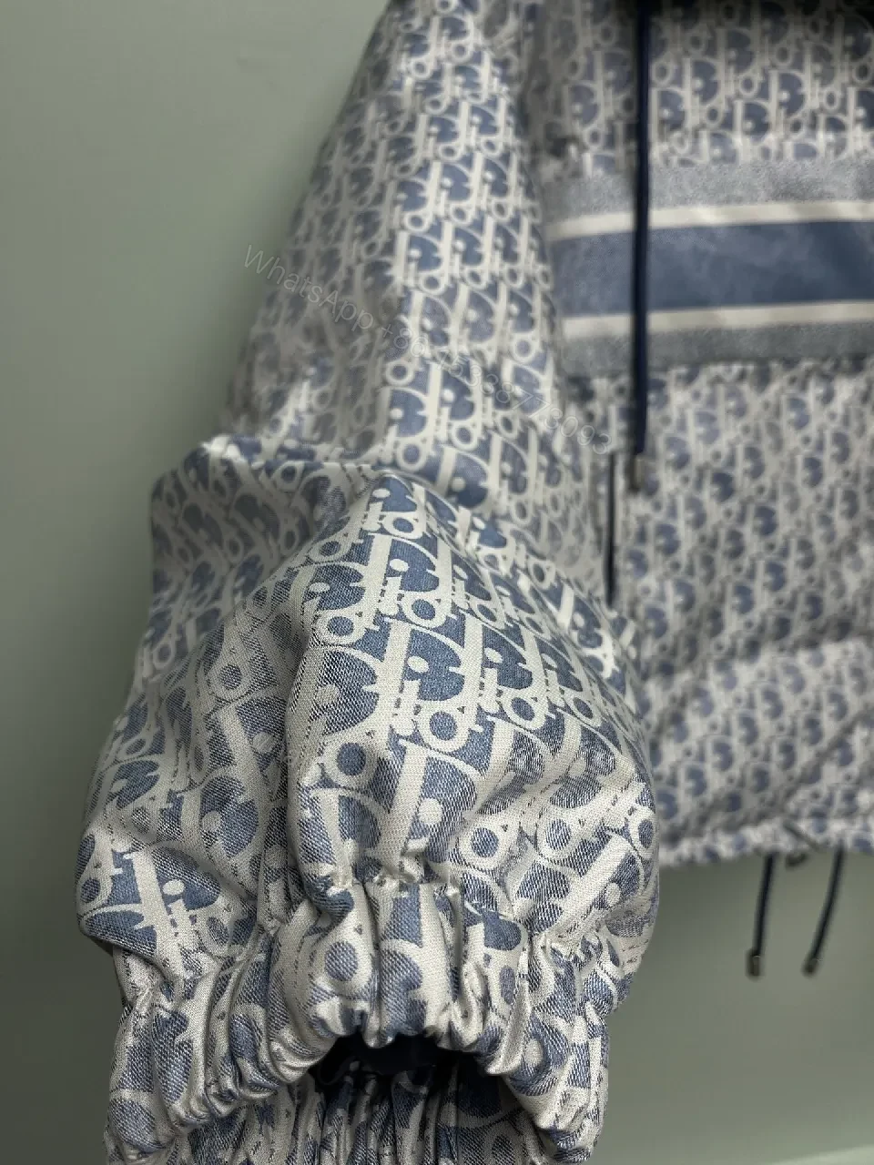 View 2 of Monochrome Puffer Jacket: Monogram Texture, Modern Warmth, Street-Ready Outerwear