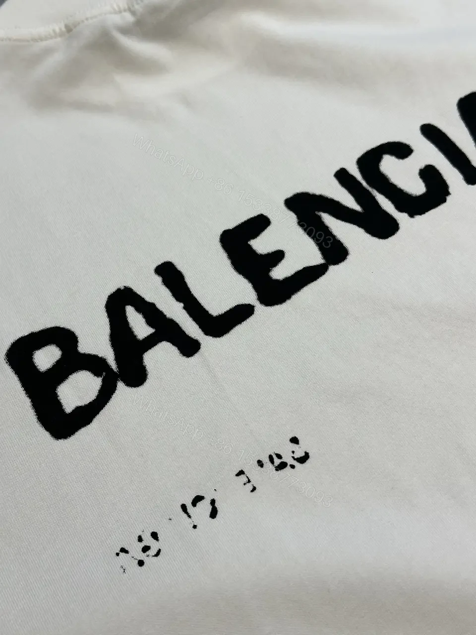 View 2 of Oversized Graphic Tee with Subtle Distress and Logo – Premium Cotton
