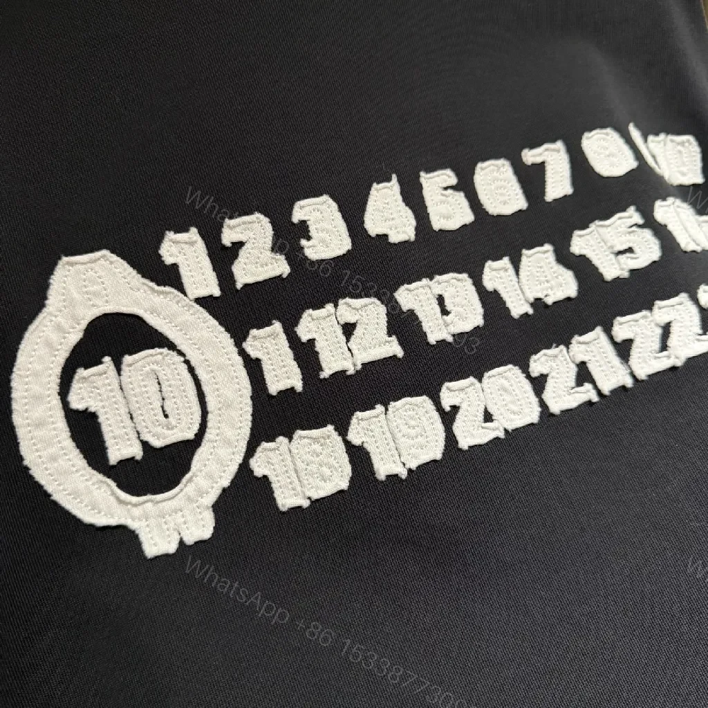 View 3 of Oversized Black Tee with Subtle Dot Logo — Luxe Everyday Wear