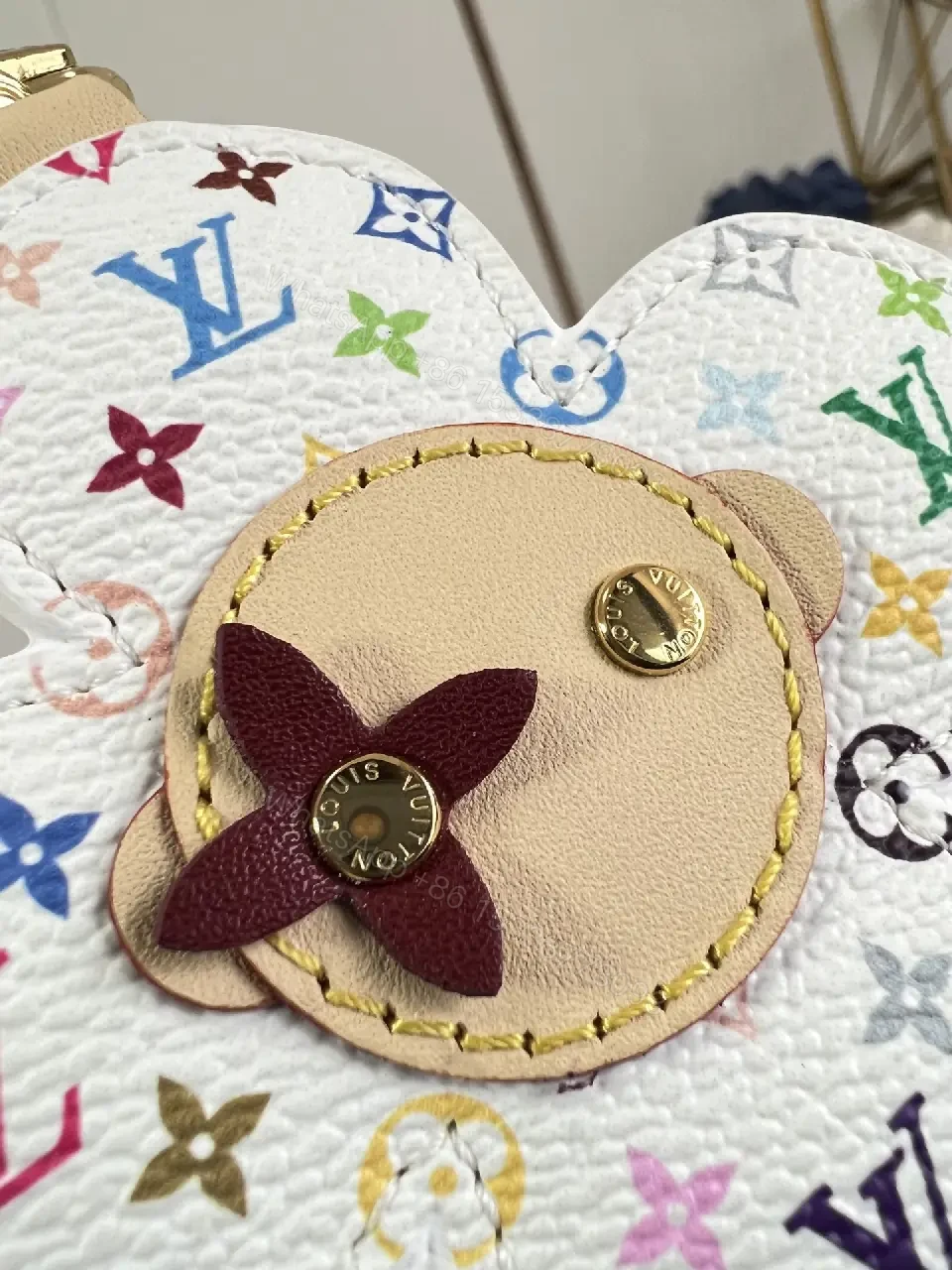 View 4 of White Leather-like Quilted Flower Keychain - LV Monogram Accent, Gold Hardware