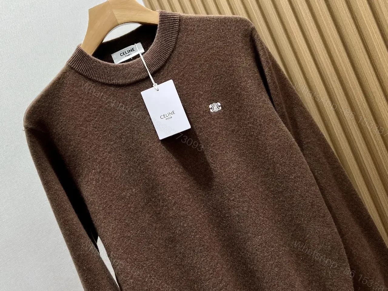 View 2 of Rich Cocoa Knit Sweater in Marled Texture with Crest Embroidery