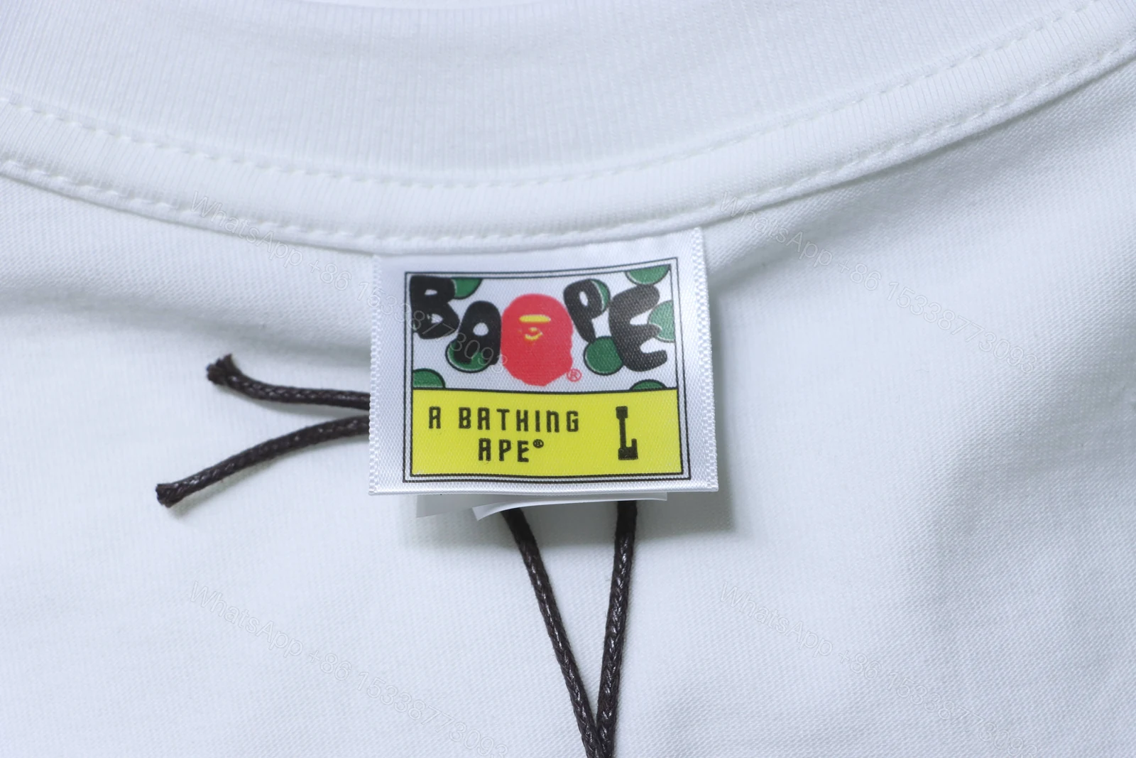 View 7 of BAPE check-pattern ape head letter print short-sleeved T-shirt in white