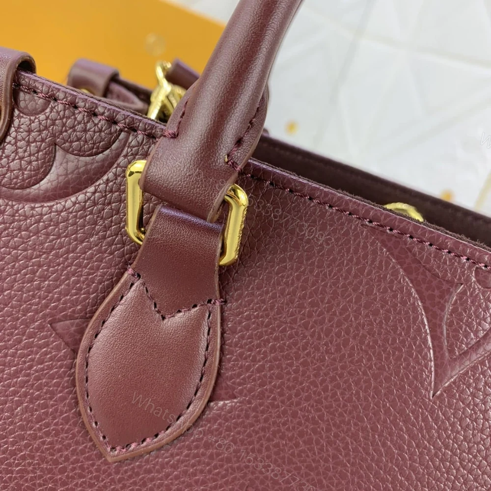 View 4 of Louis Vuitton Onthego MM Monogram Empreinte Wine Red 35Cm M46601