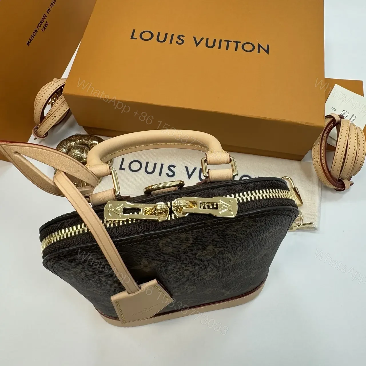 View 4 of Louis Vuitton Alma backpack in the signature brown monogram canvas
