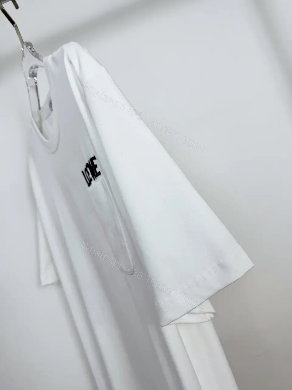 View 2 of Minimalist White Cotton Tee with Bold Pocket, Everyday Luxury Top