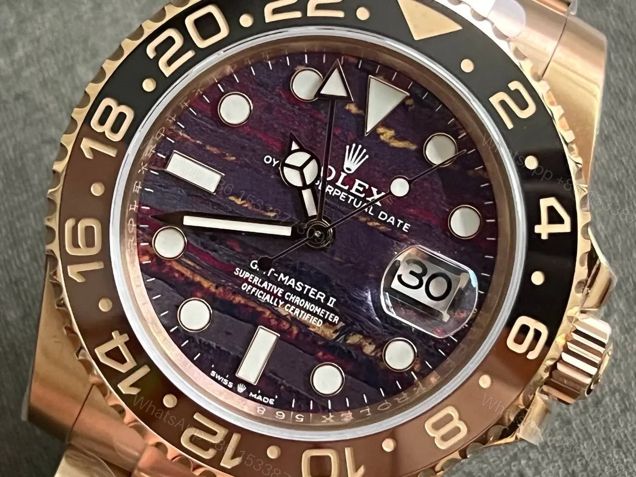 View 9 of Rolex GMT-Master II 126715CHNR Tiger Iron Dial