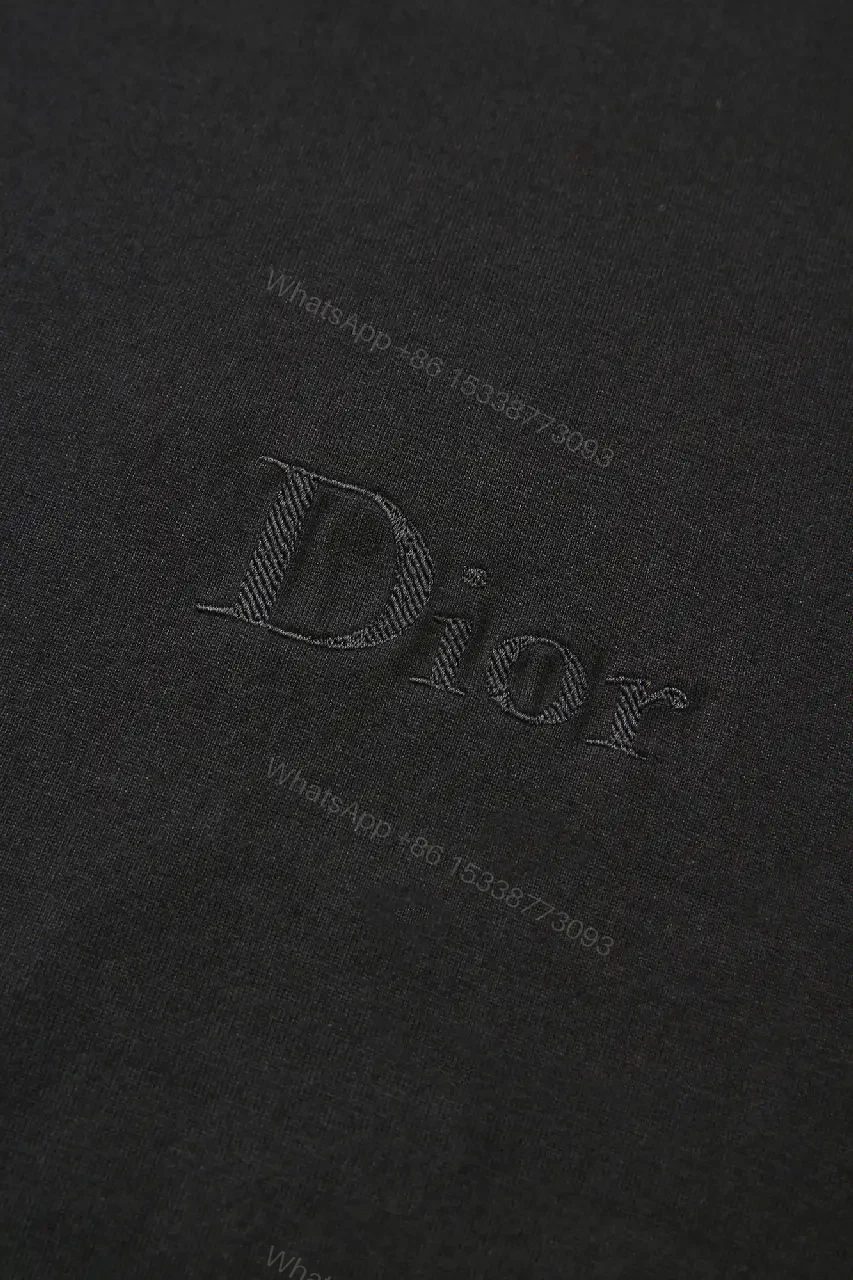 View 4 of Minimalist Black Cotton Tee with Subtle Embossed Logo - T‐Shirt