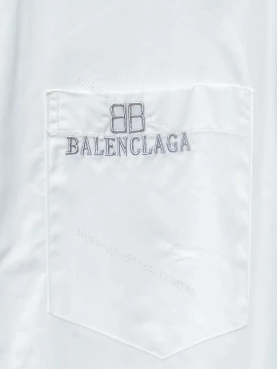 View 8 of Minimalist Button-Front Shirt with Subtle Logo Detail