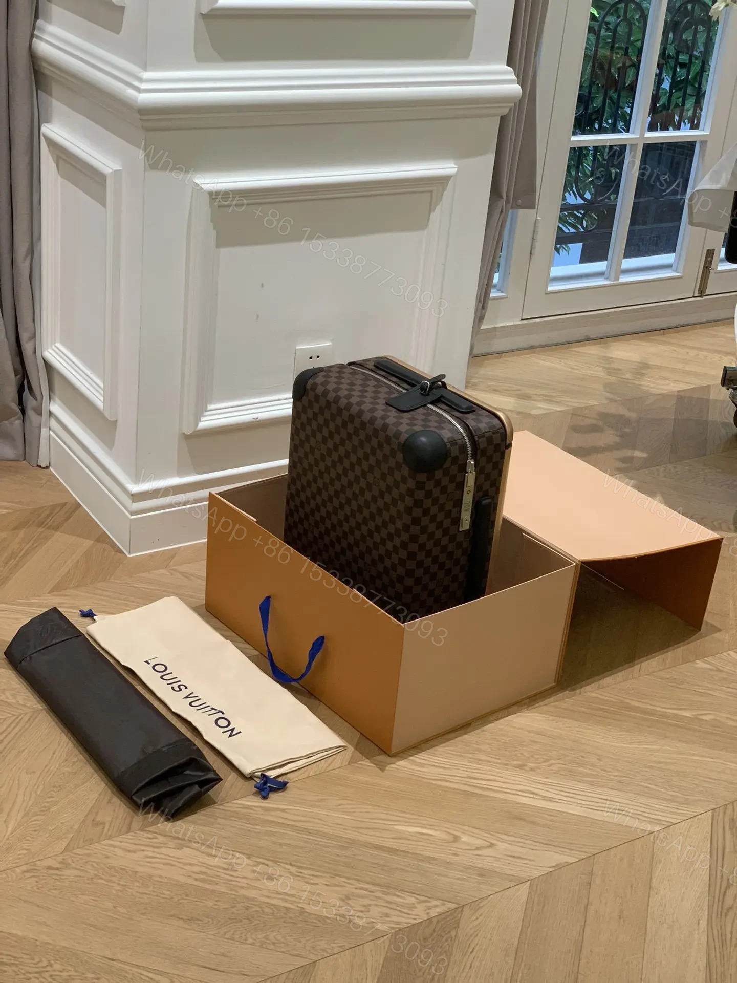 View 4 of Louis Vuitton Horizon 55 rolling suitcase in Damier Ebene canvas.