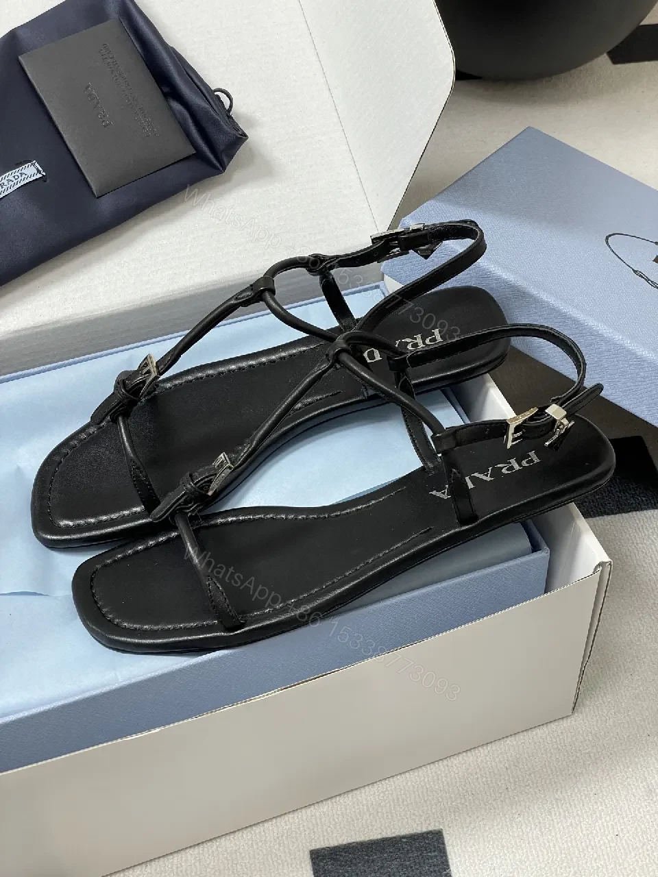 View 5 of Minimal Black Leather T-Strap Sandals with Padded Comfort