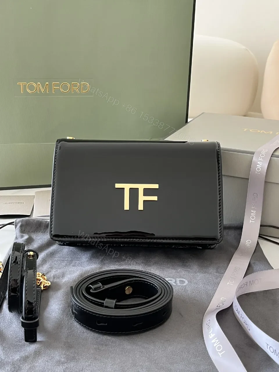 View 4 of Compact Black Leather Crossbody with Gold TF Emblem