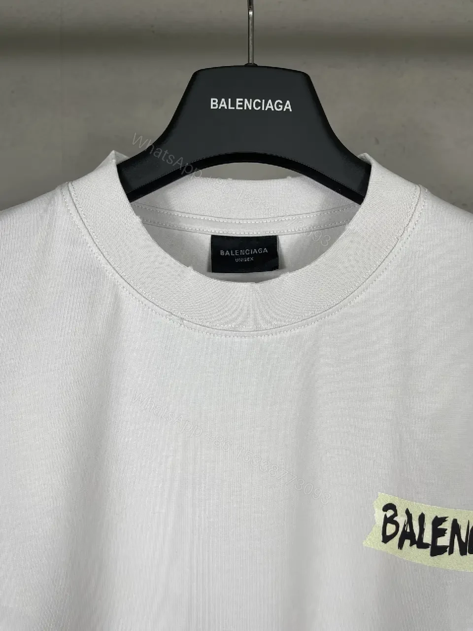 View 6 of Oversized White Tee with Signature Patch - Minimalist Luxe