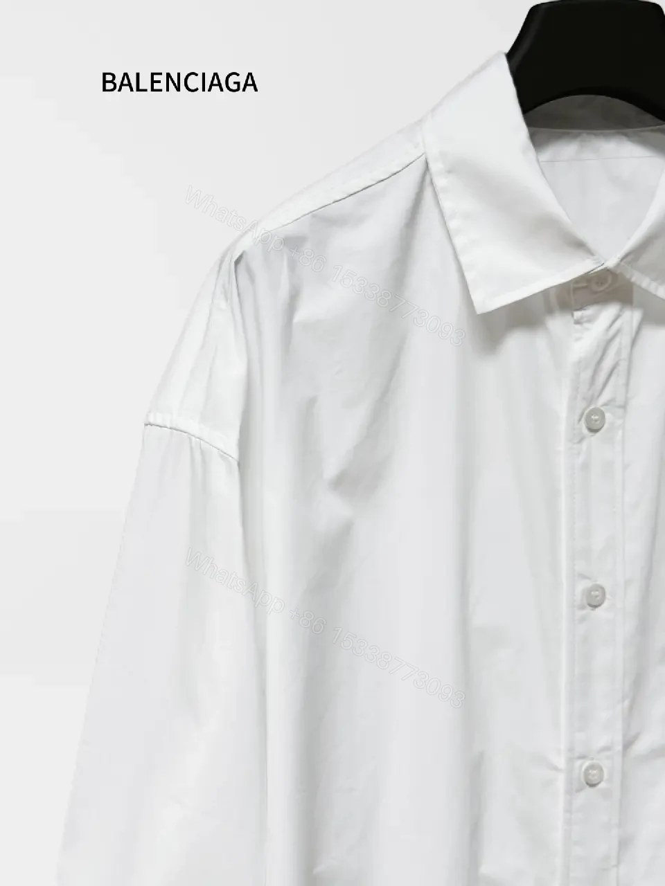 View 3 of Minimalist Button-Front Shirt with Subtle Logo Detail
