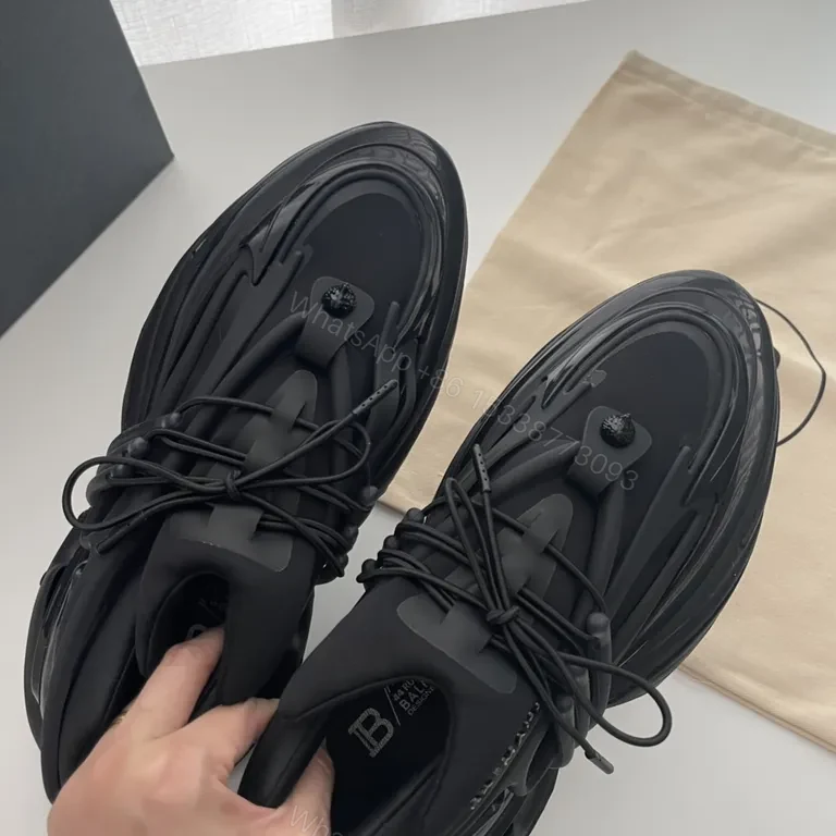View 4 of Bold Black Balmain High-Top Sneakers: Sculpted Comfort