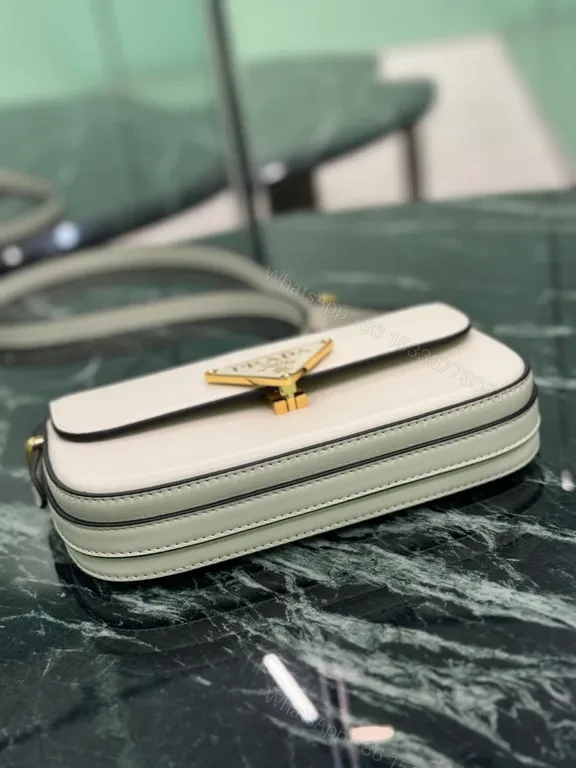 View 5 of Elegant Leather Crossbody Bag: Prada Triangle, Structured Luxury