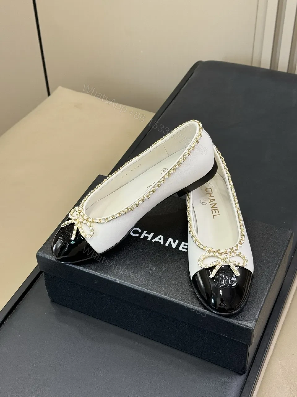 Ivory & Black Two-Tone Ballet Flats with Gold Chain Accent — view 1