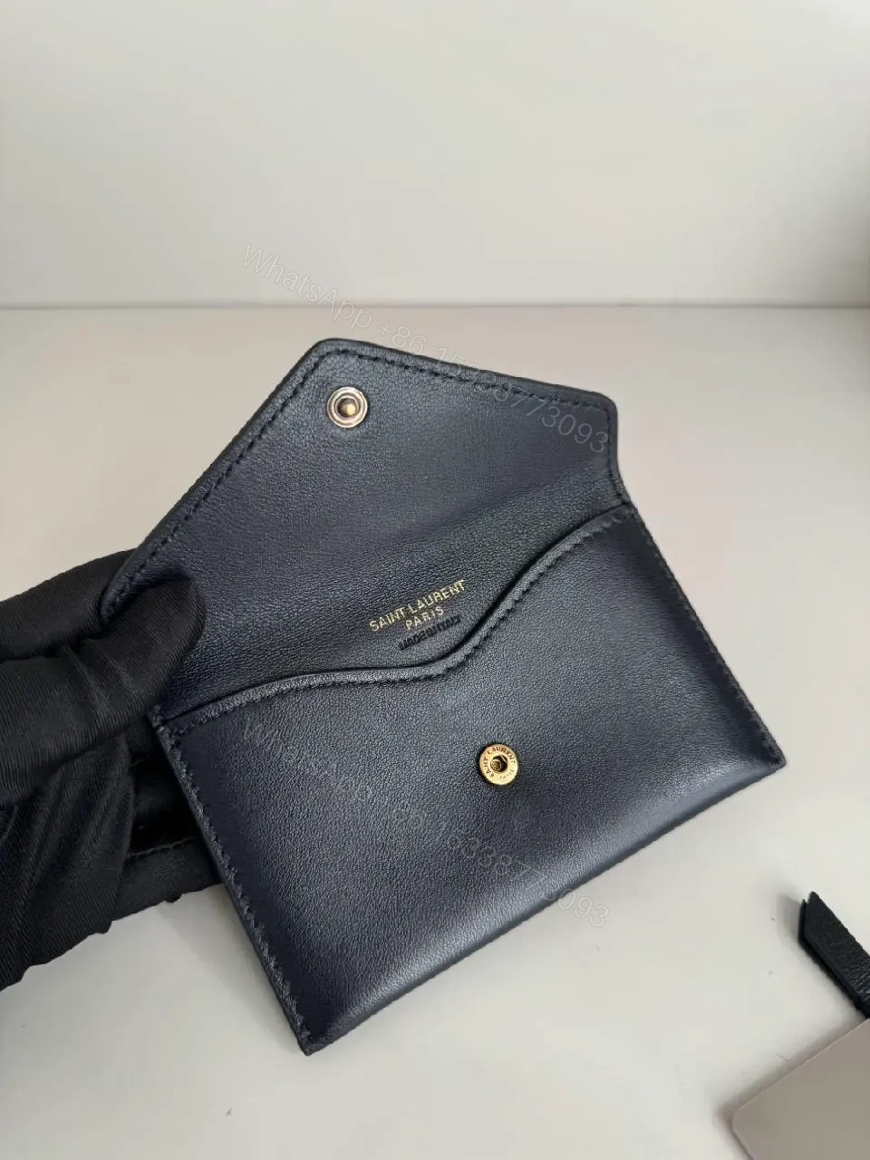 View 3 of Quilted Leather Crossbody Bag with Gold Emblem, Luxury Style