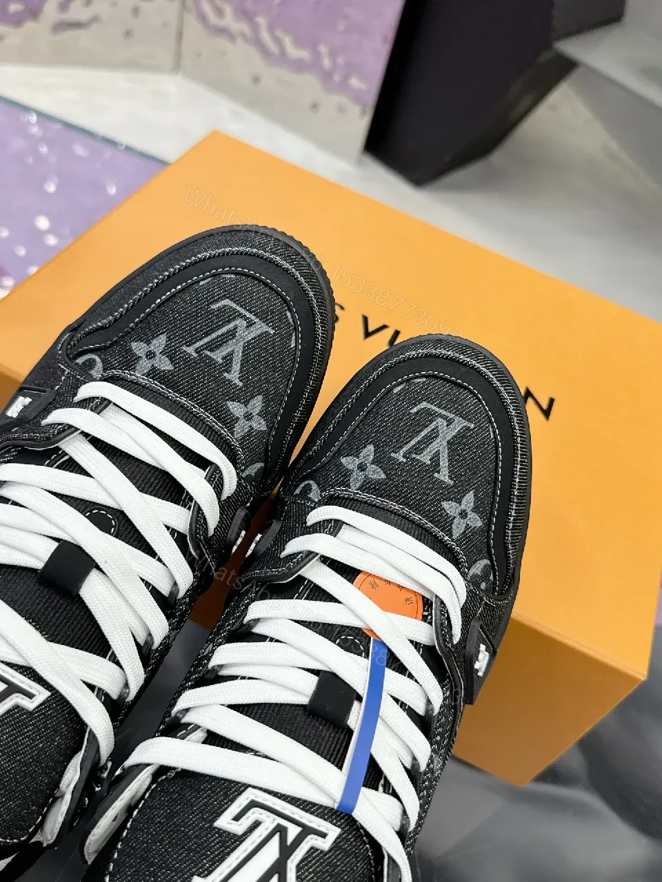 View 4 of Bold Black Denim-Textured Sneakers with LV Monogram