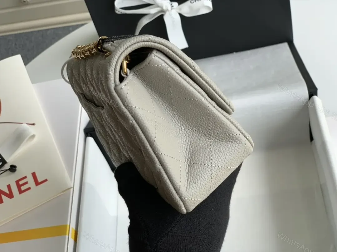 View 8 of Quilted Leather Crossbody: Compact Luxury with Gold Hardware