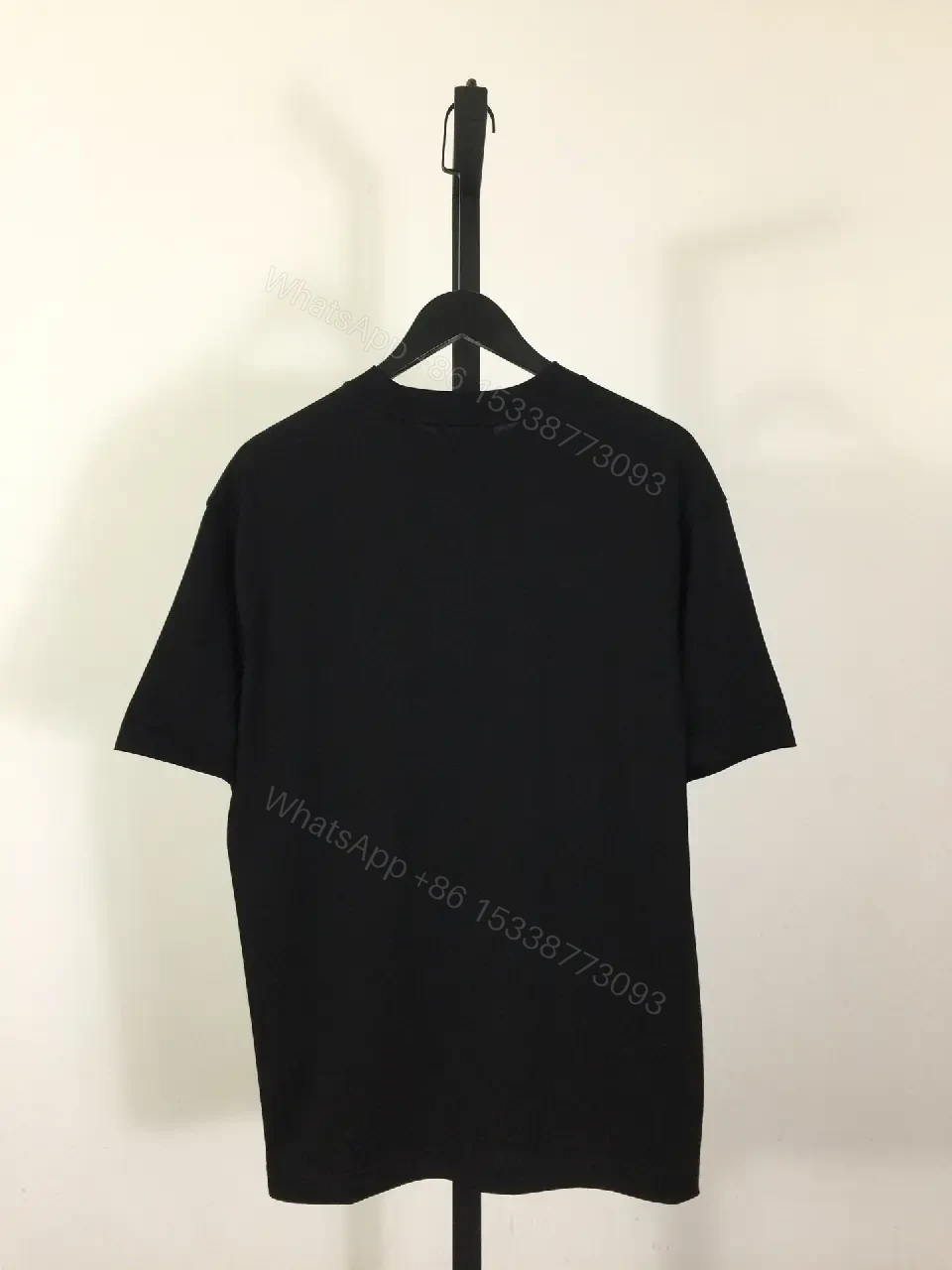 View 5 of Black Cotton Tee — Elevated Streetwear Logo Tee