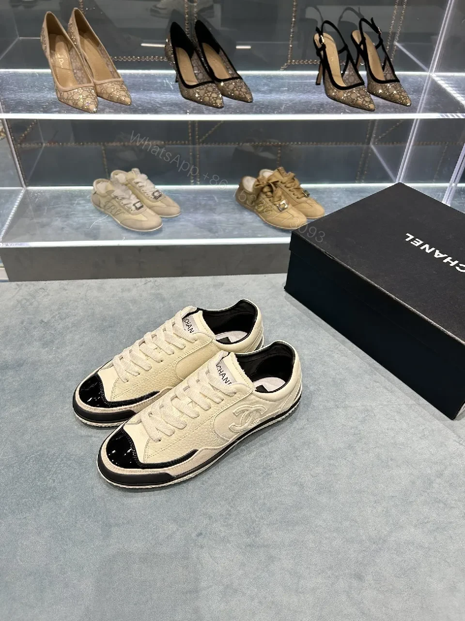 View 5 of Cream Leather Sneaker + Subtle Chanel-Inspired Detail + High-Top Comfort + Timeless Glossy Toe + Sneaker