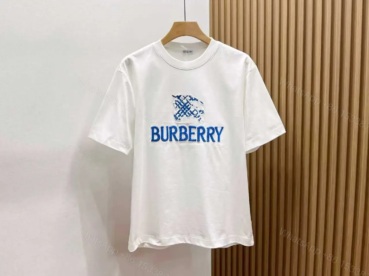 View 9 of Black Knit Tee with Embroidered Crest Logo – Premium Street Style T-shirt