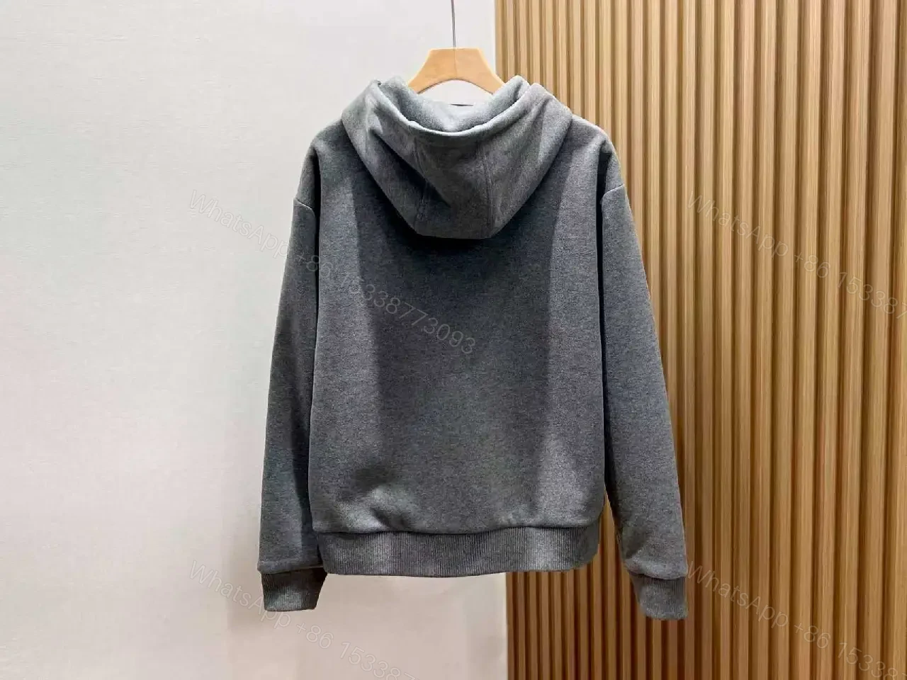 View 2 of Cozy Black Knit Zip Hoodie with Subtle Emblem Embellishment