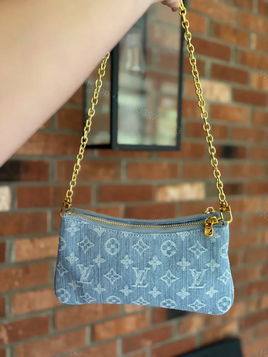 View 3 of Louis Vuitton Liv Pochette in Blue Denim