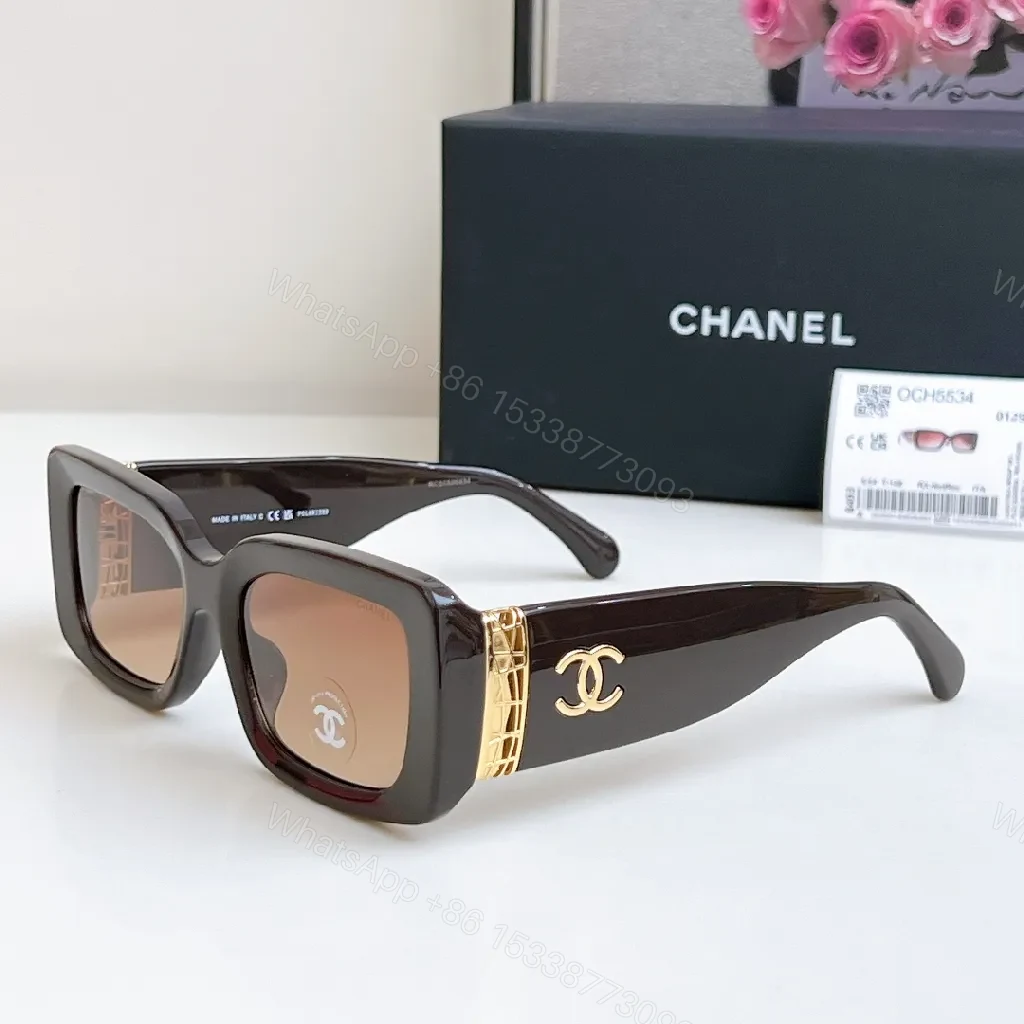 Bold Black Leather-Accented Sunglasses with Gold Accents — view 1