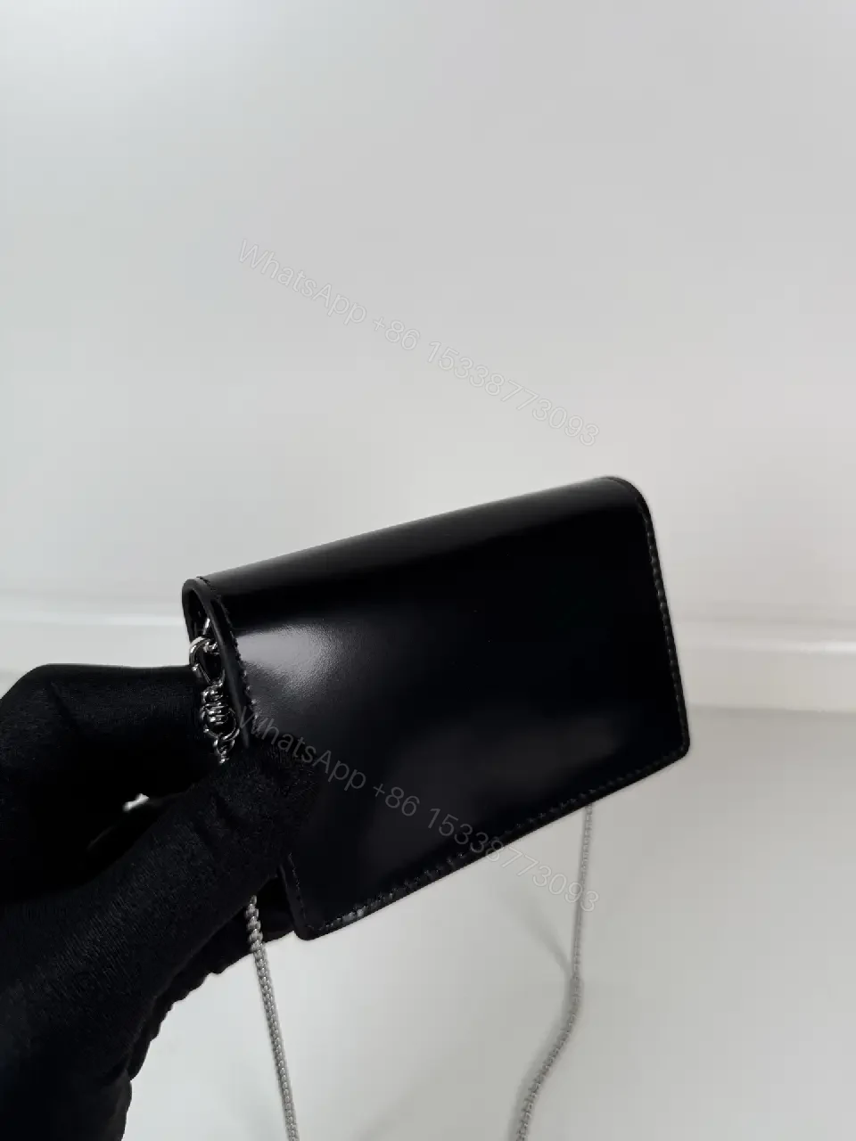 View 2 of Chic Black Leather Mini Bag with Signature Logo Chain