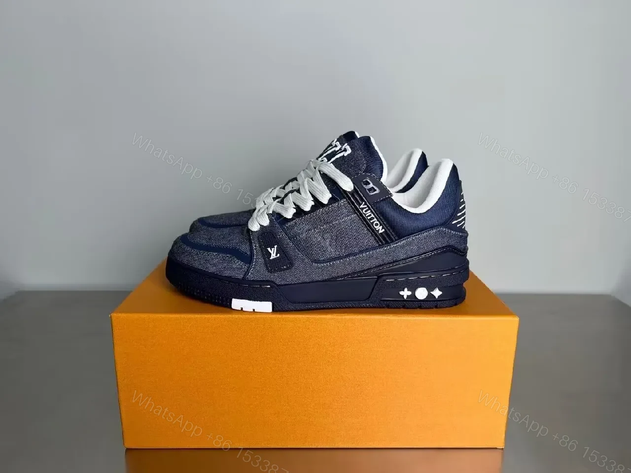 View 2 of Denim-Texture Luxury Sneaker with Signature Motifs, High-Top