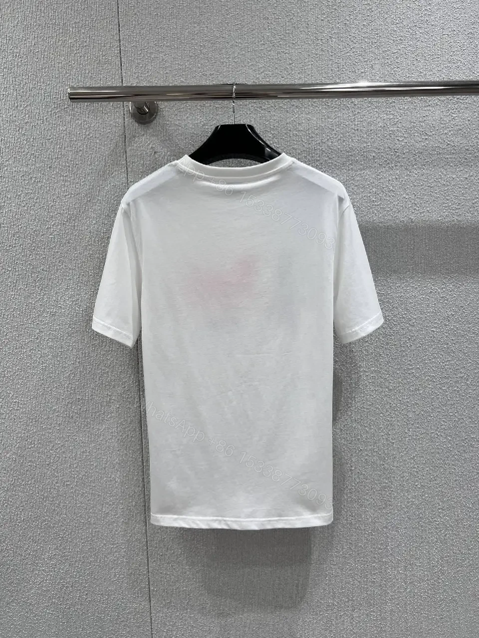 View 6 of Minimalist White Tee — Premium Cotton, Subtle Logo, Modern Style